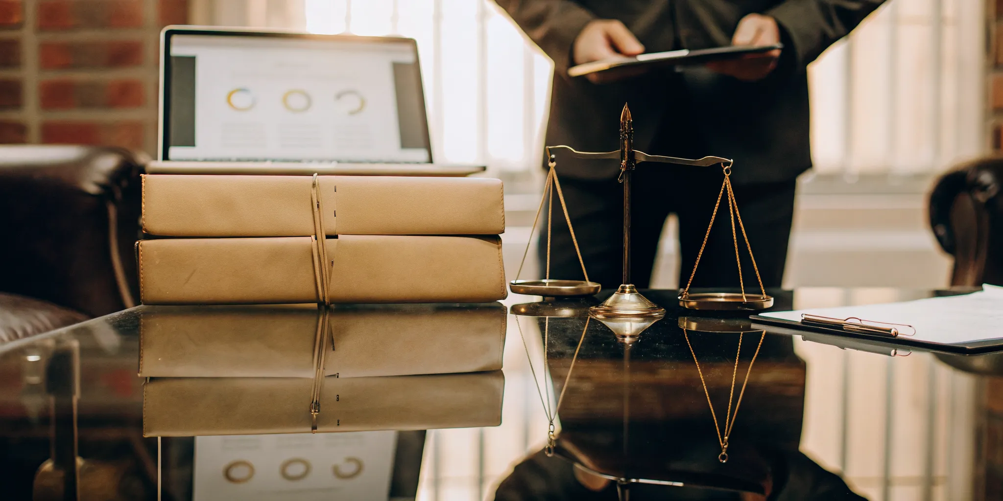 Legal scales and documents on a desk for a tenant screening discrimination complaint.