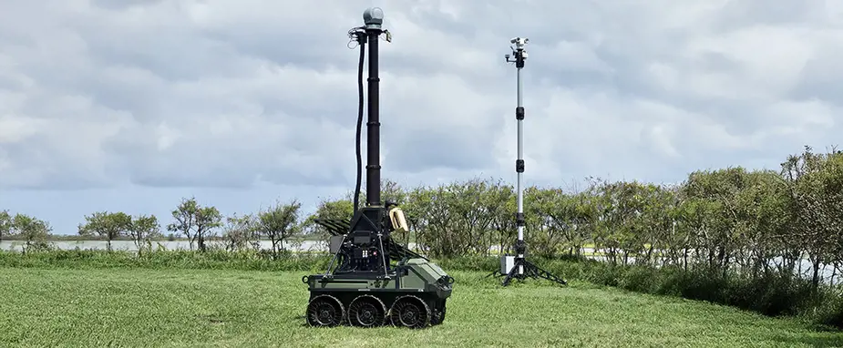 Grey vehicle with mounted EchoShield radars against a black background with grey hexagon pattern