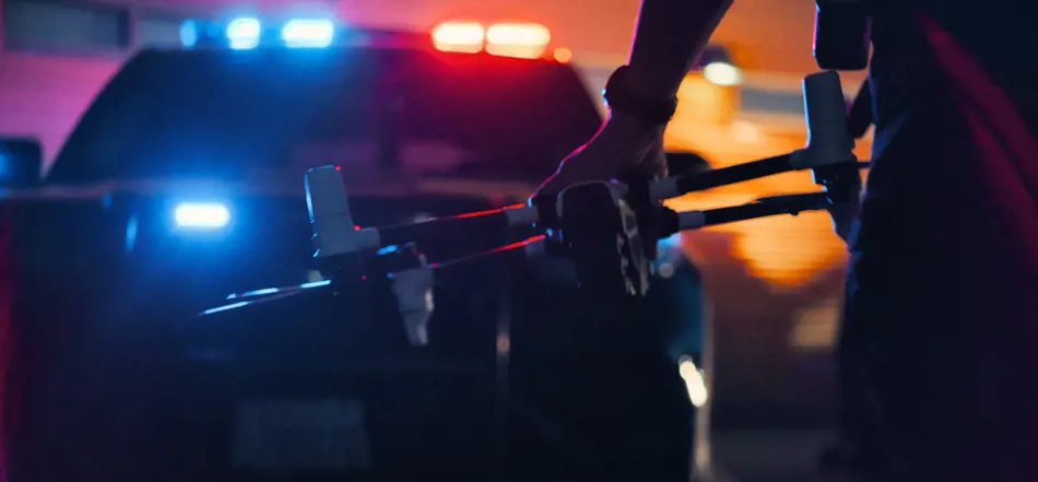 Grey vehicle with mounted EchoShield radars against a black background with grey hexagon pattern