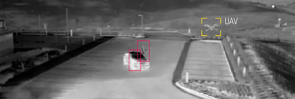 Grey vehicle with mounted EchoShield radars against a black background with grey hexagon pattern