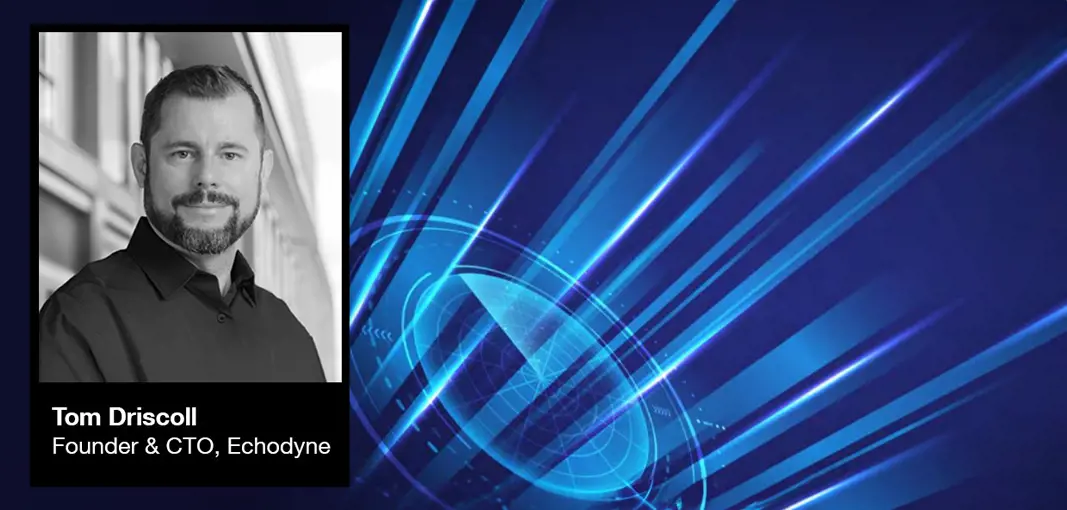 Grey vehicle with mounted EchoShield radars against a black background with grey hexagon pattern