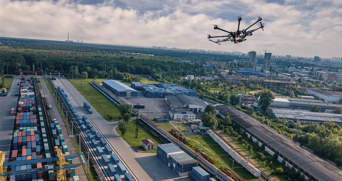 Grey vehicle with mounted EchoShield radars against a black background with grey hexagon pattern