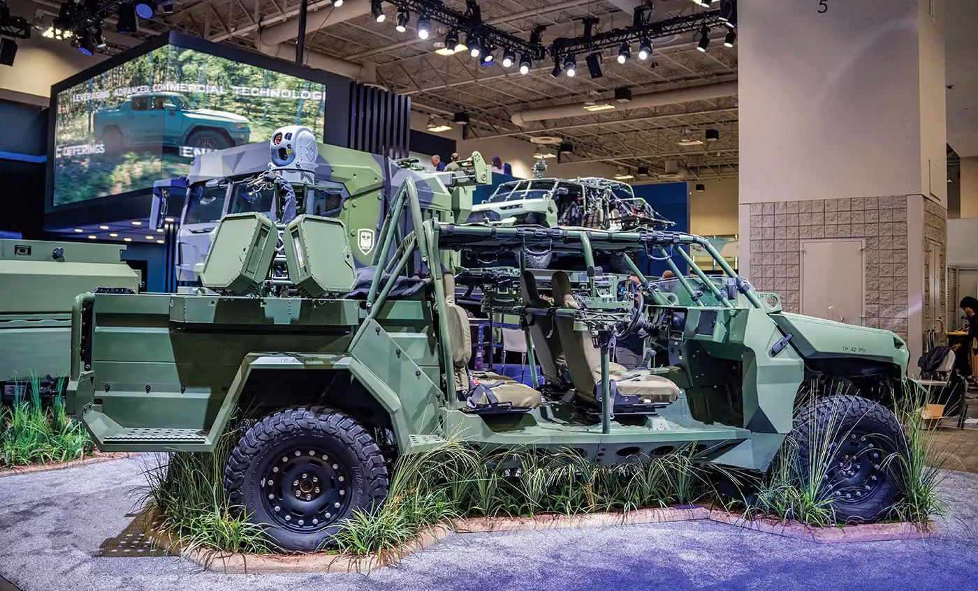 Grey vehicle with mounted EchoShield radars against a black background with grey hexagon pattern