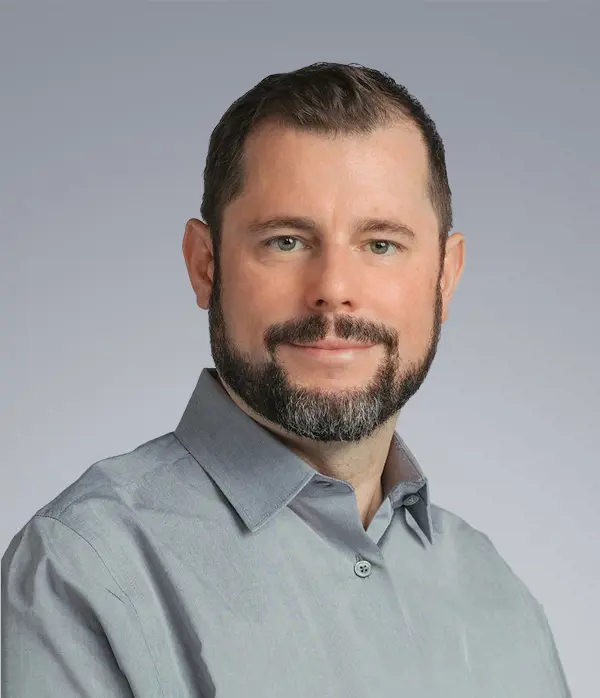 Grey vehicle with mounted EchoShield radars against a black background with grey hexagon pattern