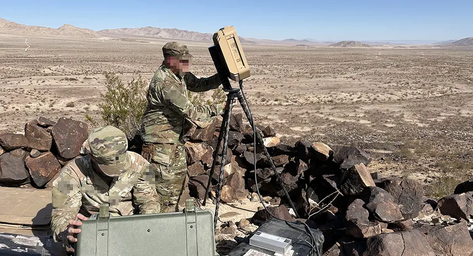 Grey vehicle with mounted EchoShield radars against a black background with grey hexagon pattern