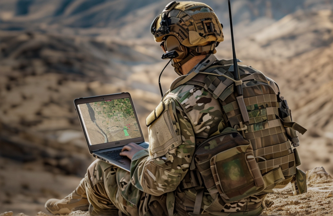 Grey vehicle with mounted EchoShield radars against a black background with grey hexagon pattern