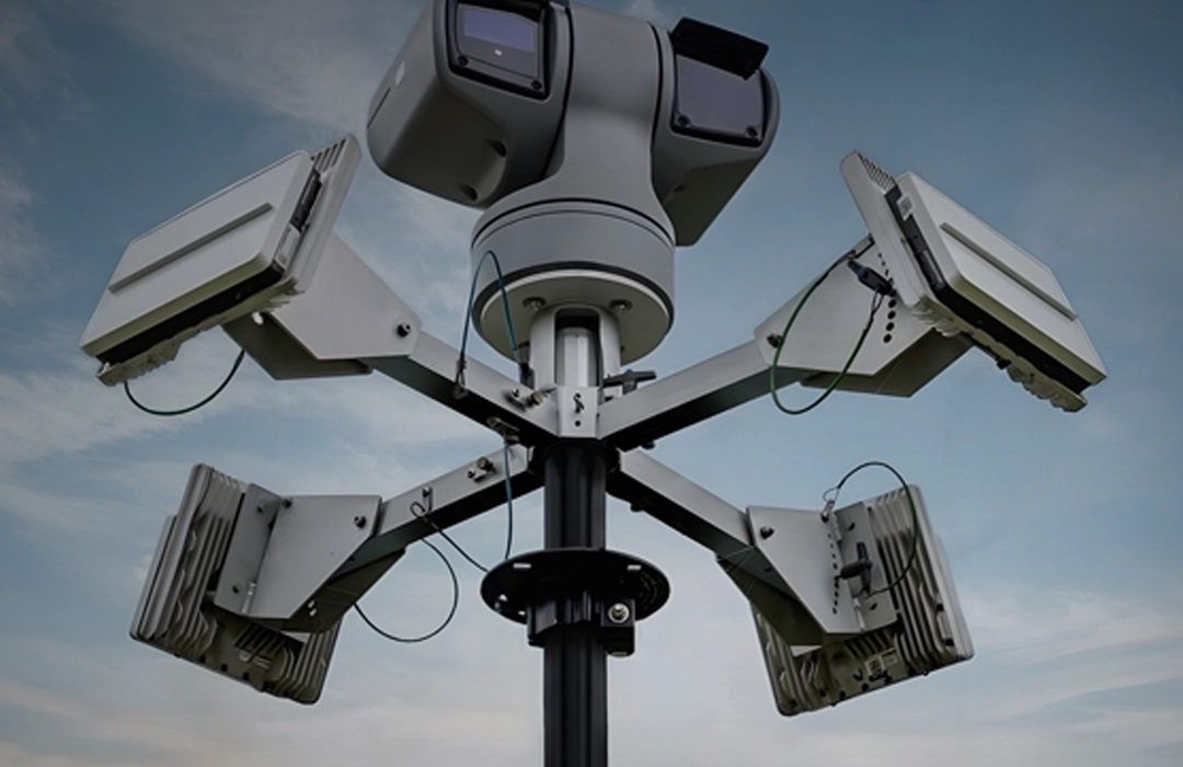 Grey vehicle with mounted EchoShield radars against a black background with grey hexagon pattern