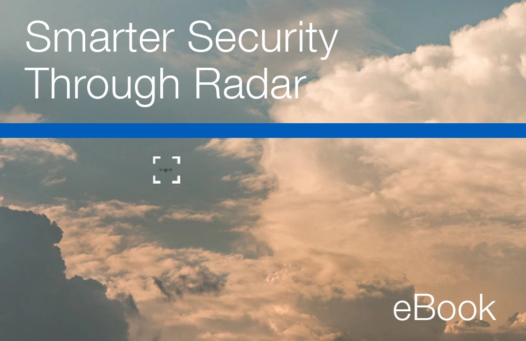 Grey vehicle with mounted EchoShield radars against a black background with grey hexagon pattern