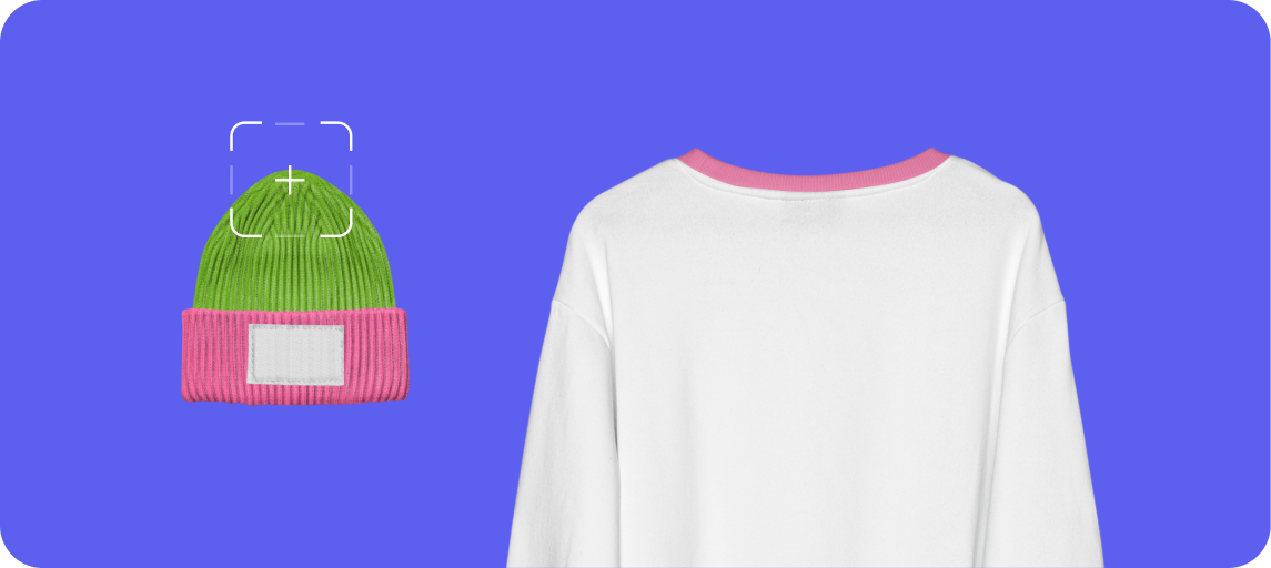 White sweatshirt with pink collar detail next to a green and pink knit beanie with a blank rectangular patch on the cuff.