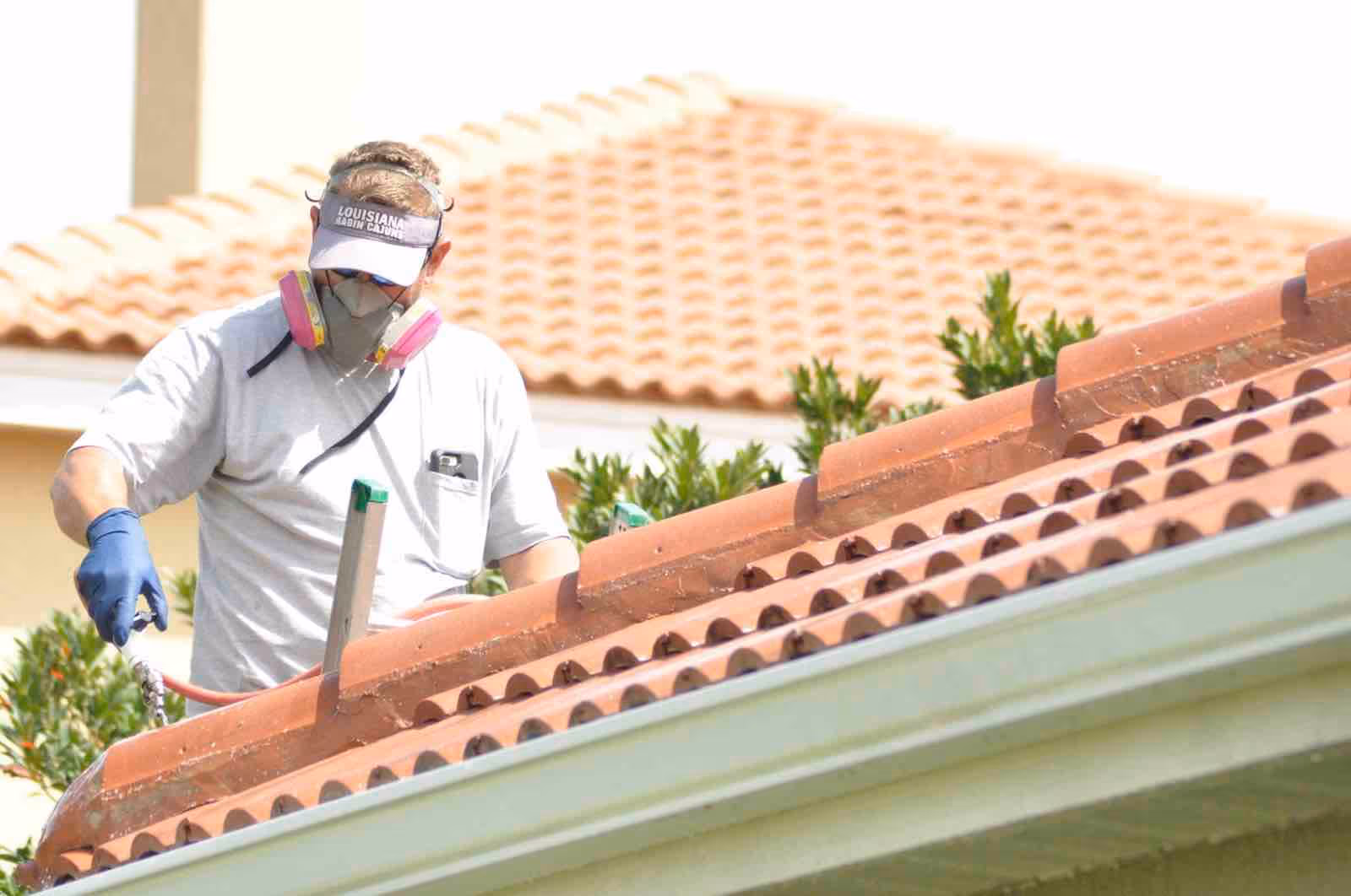 Professional roof soft washing Longwood FL removing black algae streaks from shingle roof