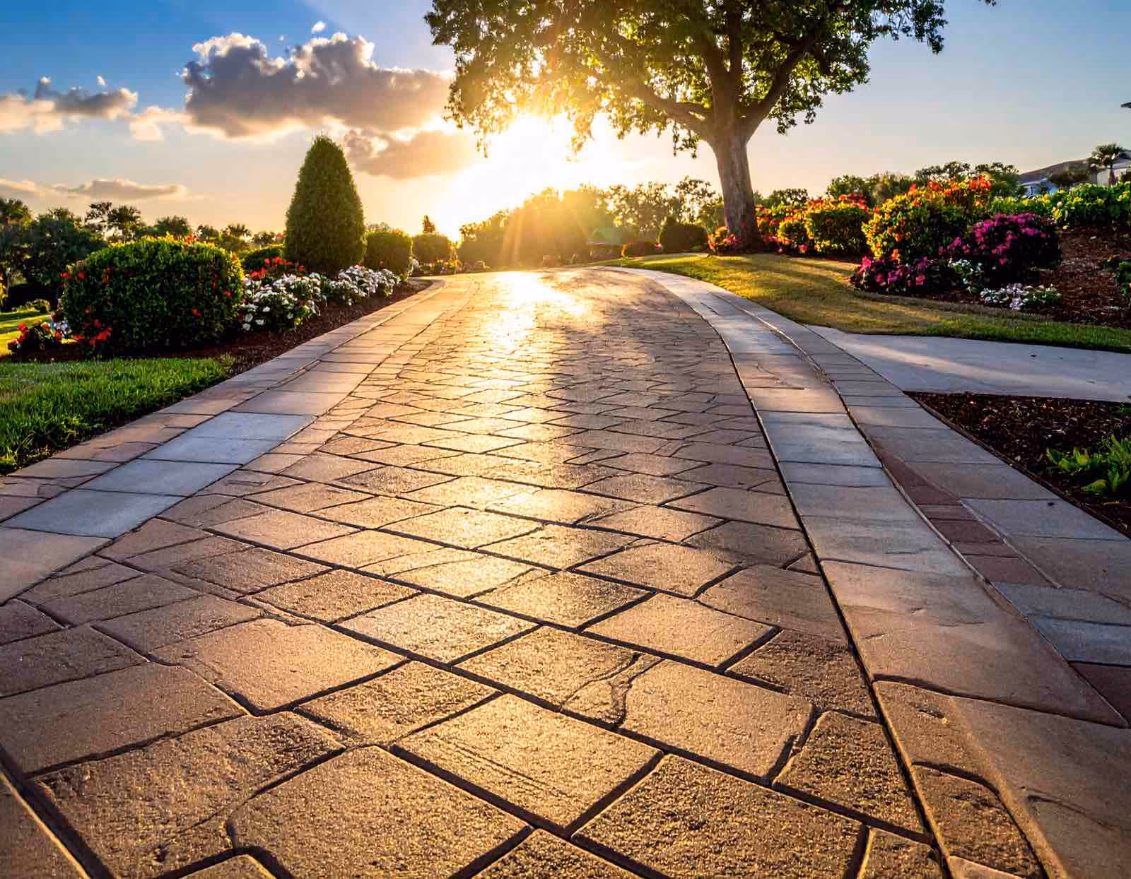 Before and after paver sealing Longwood FL showing enhanced color and protection by Ragin Cajun Soft Wash