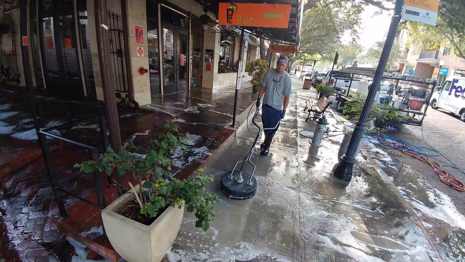 Professional commercial pressure washing by Ragin Cajun Soft Wash restoring restaurant patio and walkways