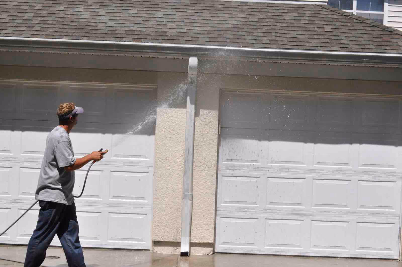 Power washing Longwood driveway by Ragin Cajun Soft Wash removing embedded dirt and grime