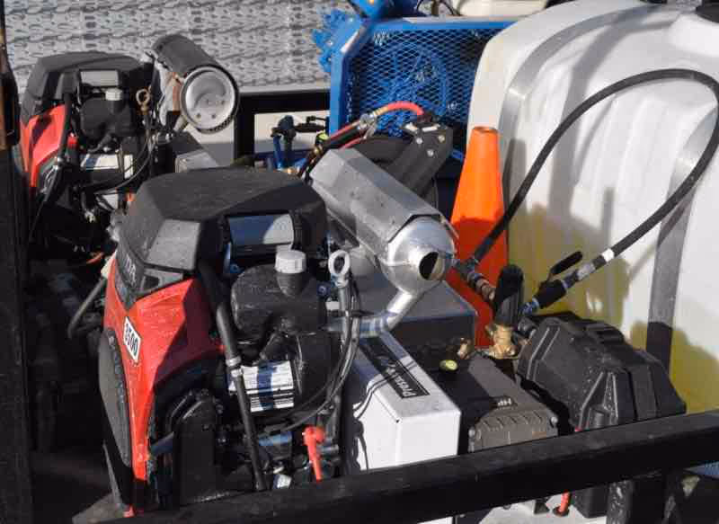 Pressure washing specialist cleaning pool cage frame and screens to remove green streaks in Central Florida