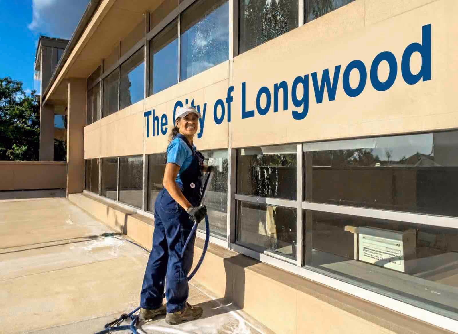 Custom window cleaning specialist using squeegee technique on multi-pane windows in Central Florida home