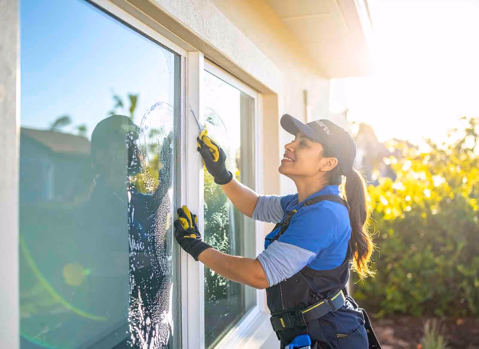 Before and after custom window cleaning showing restored clarity on picture windows and glass doors