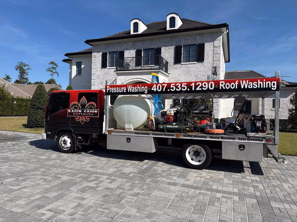 Eco-friendly roof soft washing treatment protecting shingles and removing contaminants on a Longwood area home