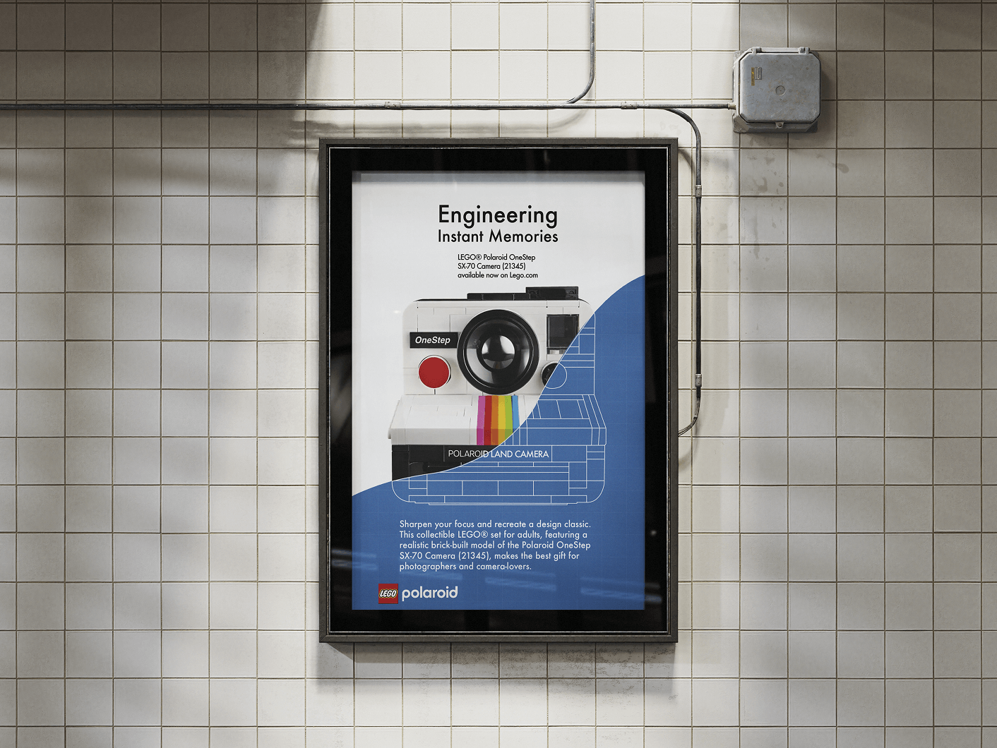 Poster in a subway station advertising a LEGO Polaroid OneStep SX-70 Camera set with text about engineering instant memories.