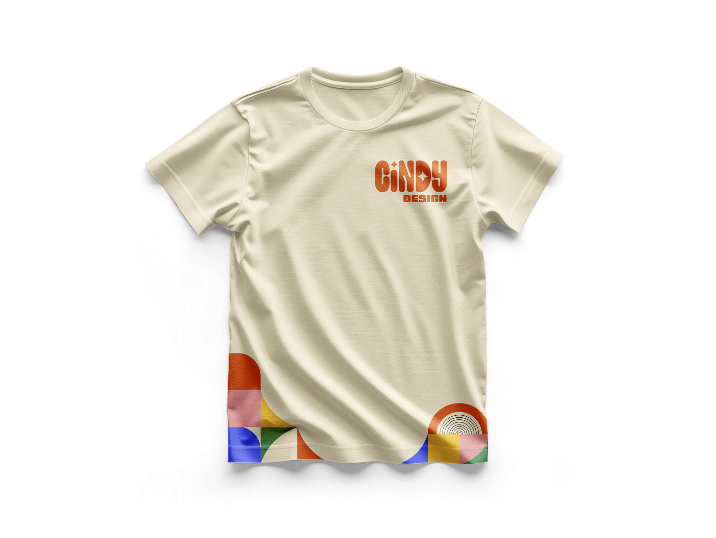 Beige t-shirt with orange text 'CINDY DESIGN' on the upper left chest and colorful geometric patterns along the bottom edges.