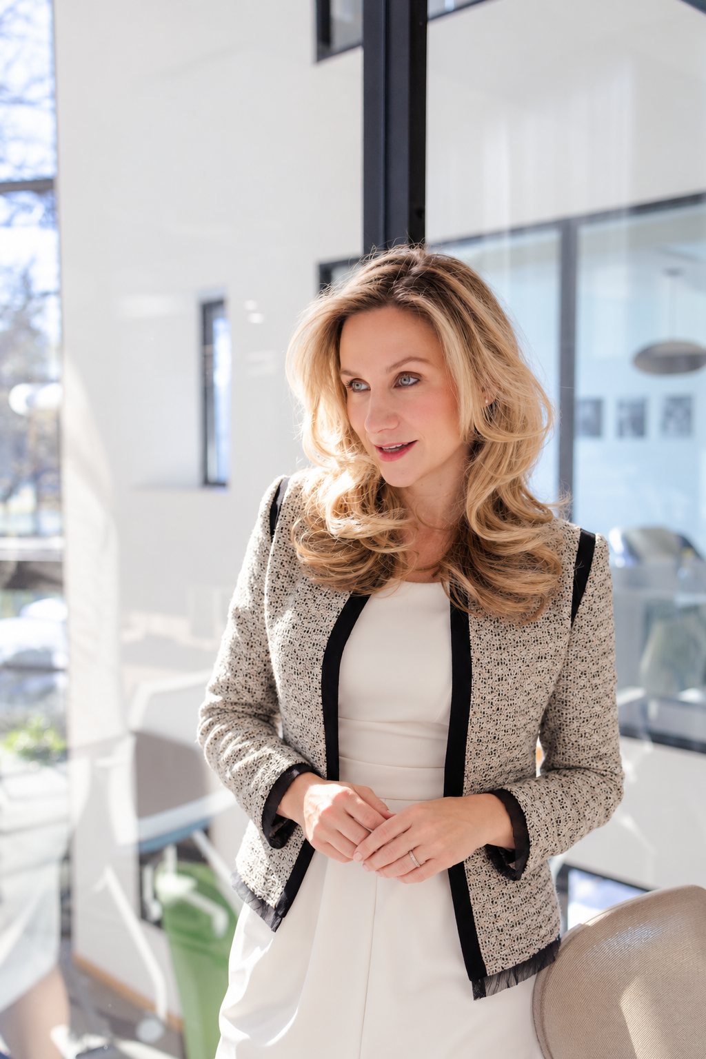 Christina Muller standing by an office window