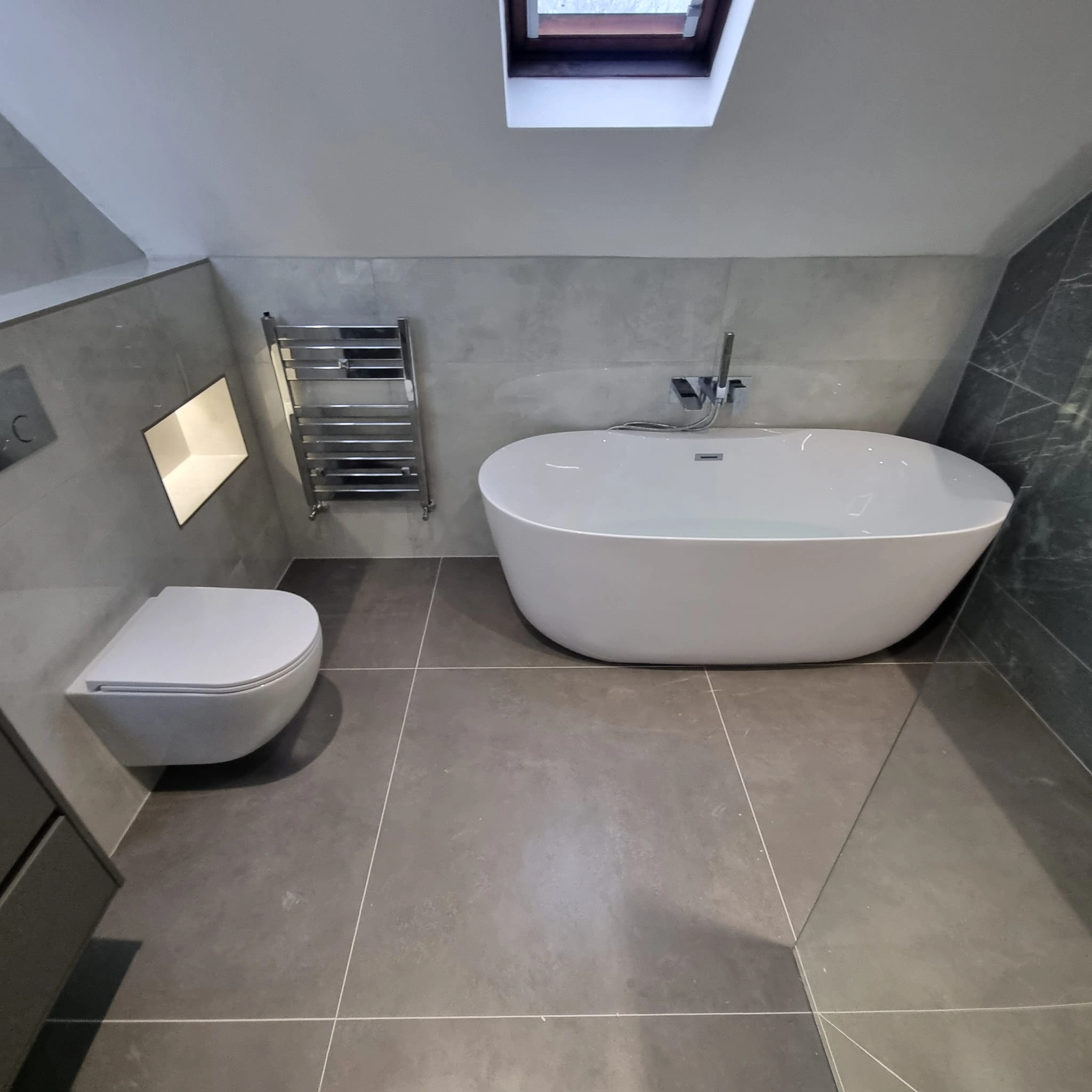 Luxury bathroom renovation with freestanding bathtub and walk-in shower