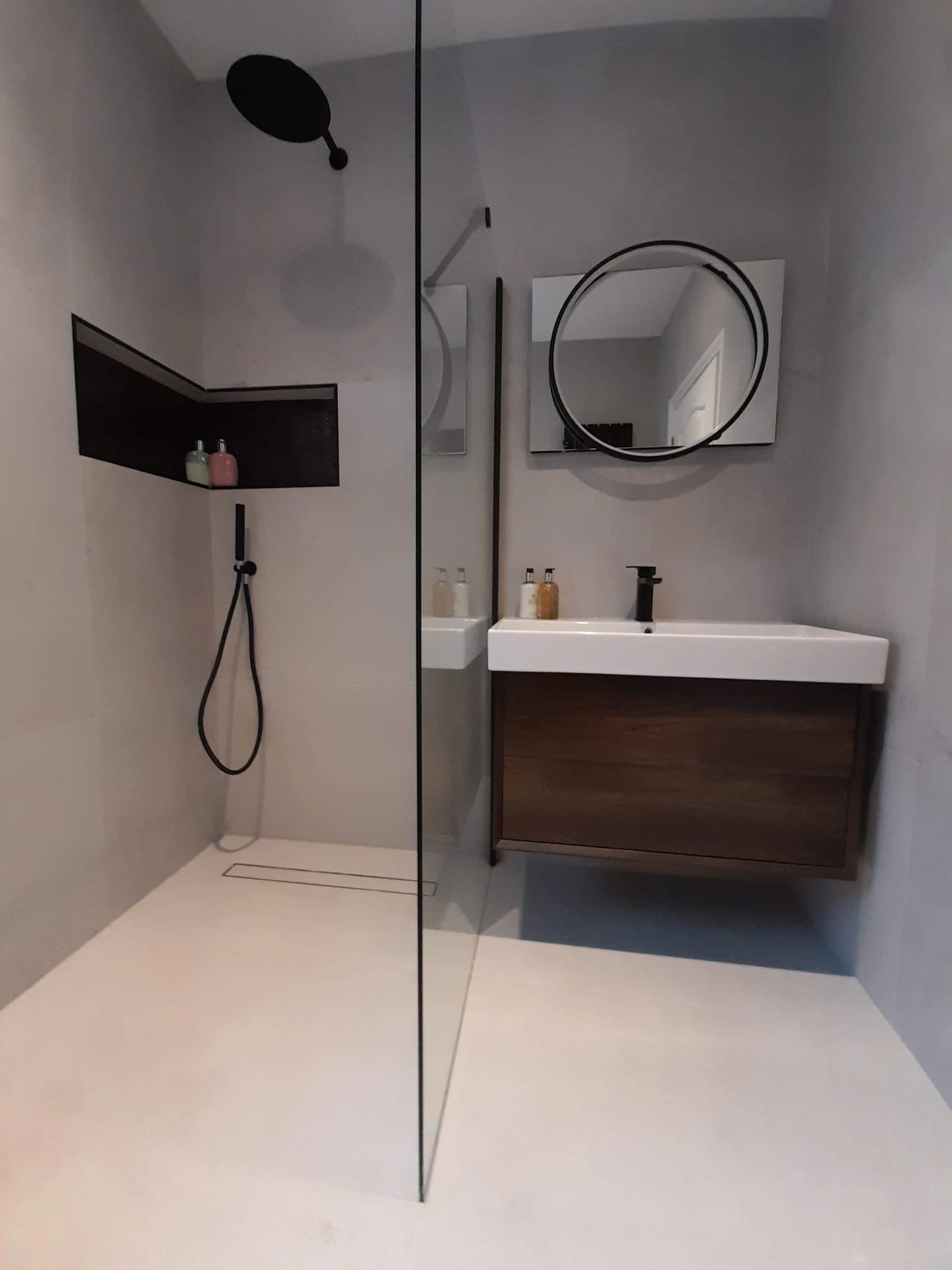 Wet room installation with walk in shower, glass screen and wall mounted vanity Meath