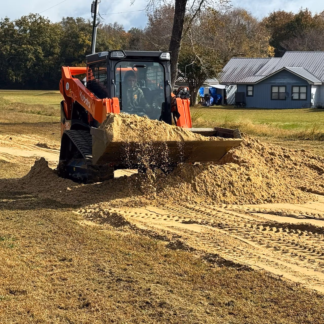 Skid steer work for grading and site preparation by Yard Rescue