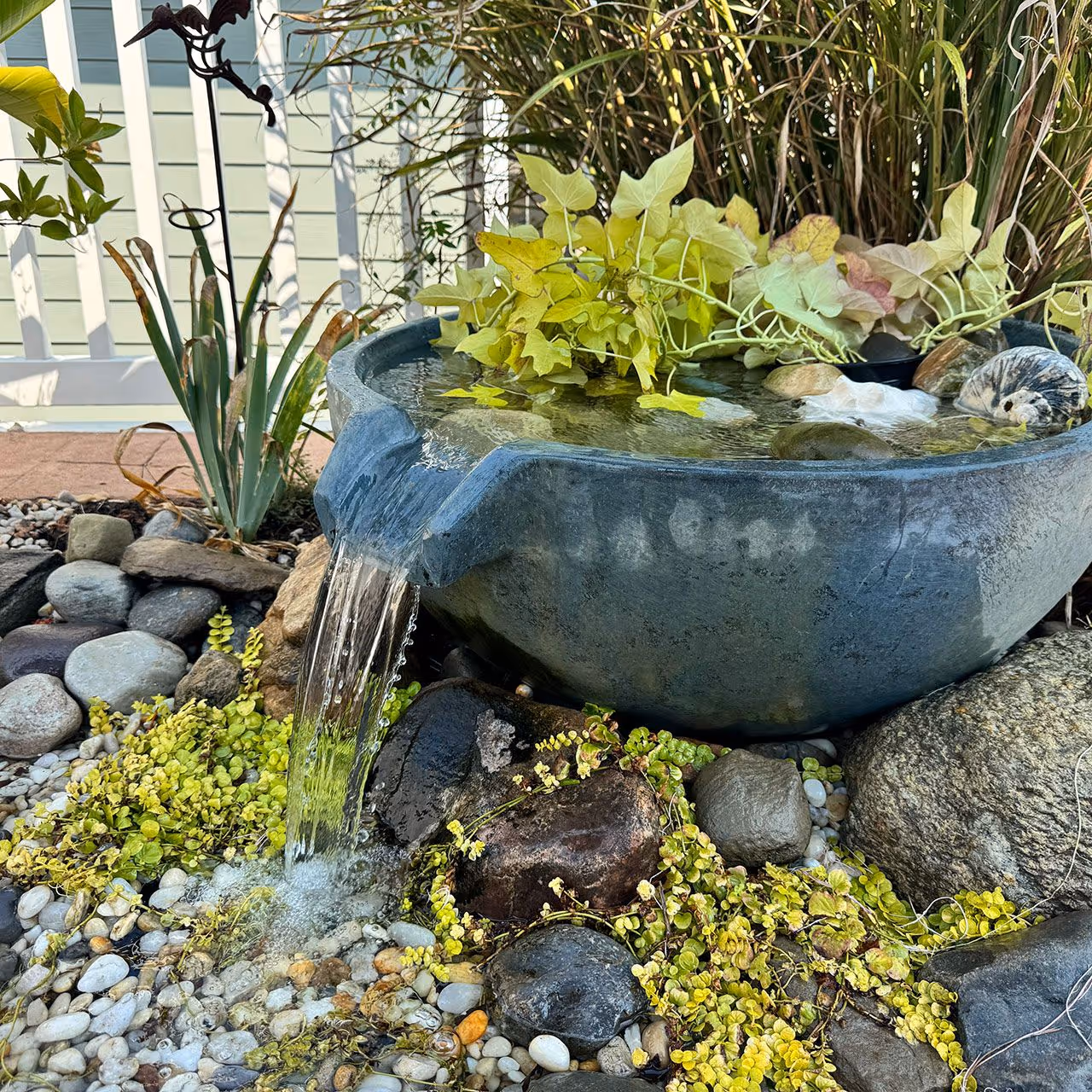 Backyard waterfall and aquascaping project by Yard Rescue