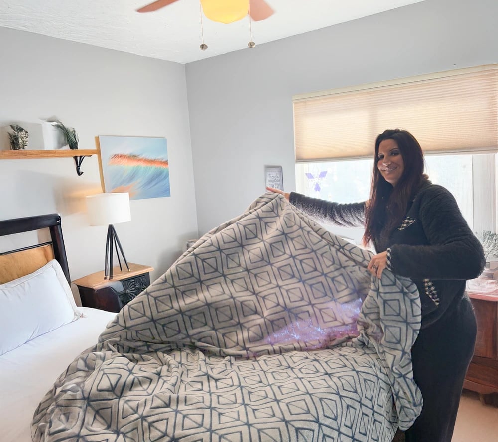 Lucky Services team member making a bed during a home cleaning in Montrose, Colorado — providing reliable, locally trusted care for homeowners and vacation rentals.