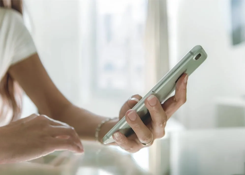 Close-up of a woman checking her phone.