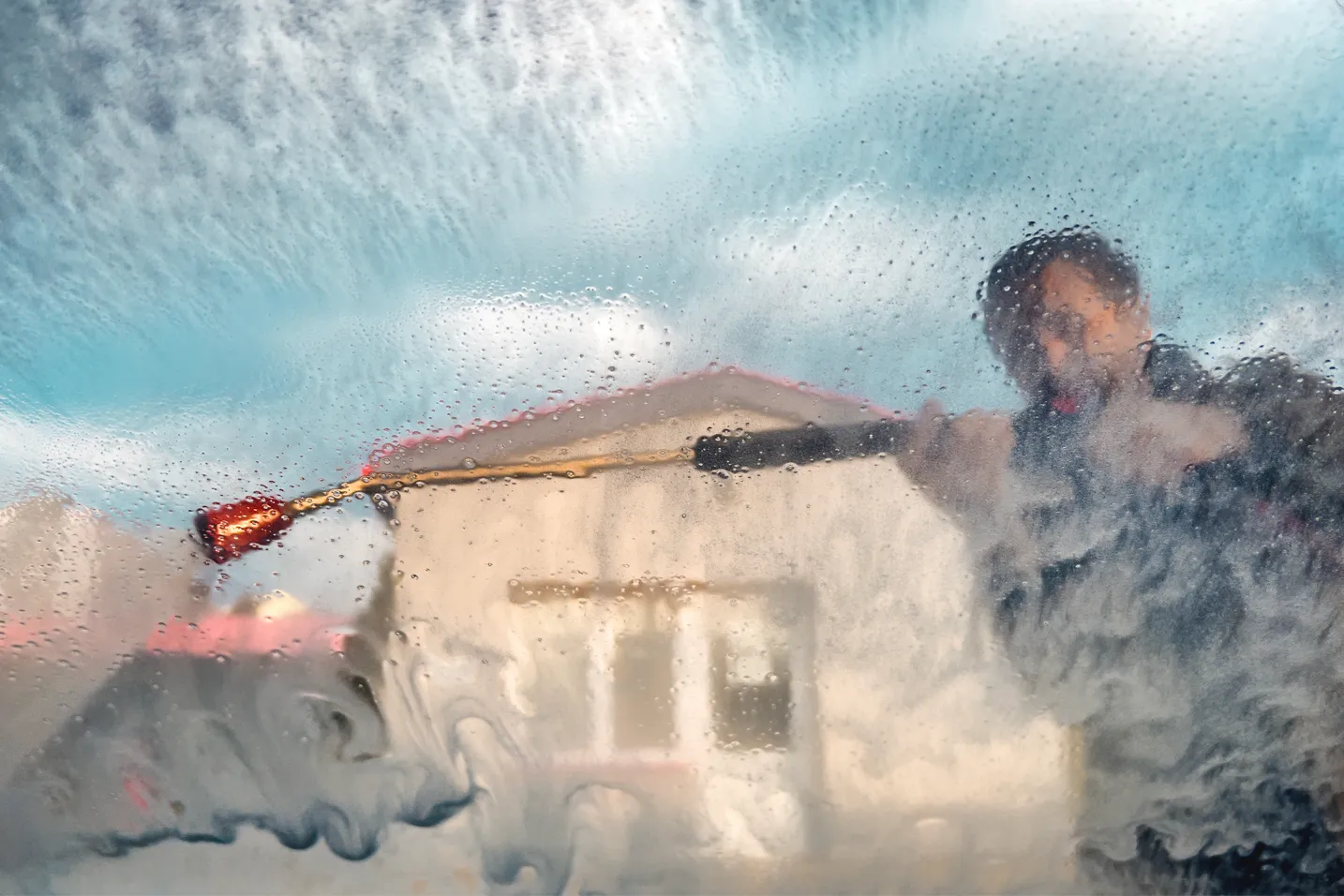Professional window washer cleaning glass in Durango and Montrose, Colorado.