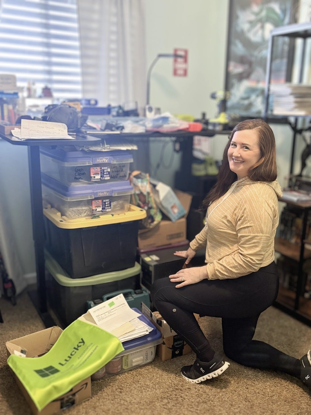 Lucky Services team member organizing supplies in a workspace, representing flexible local job opportunities in Colorado and New Mexico.