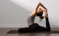 Woman practicing yoga on a mat