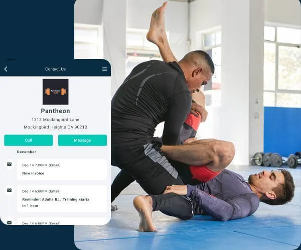 Two men practicing Brazilian Jiu-Jitsu on a blue mat in a bright room with gym equipment in the background.
