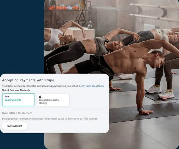 Group of people exercising indoors performing side planks on yoga mats.