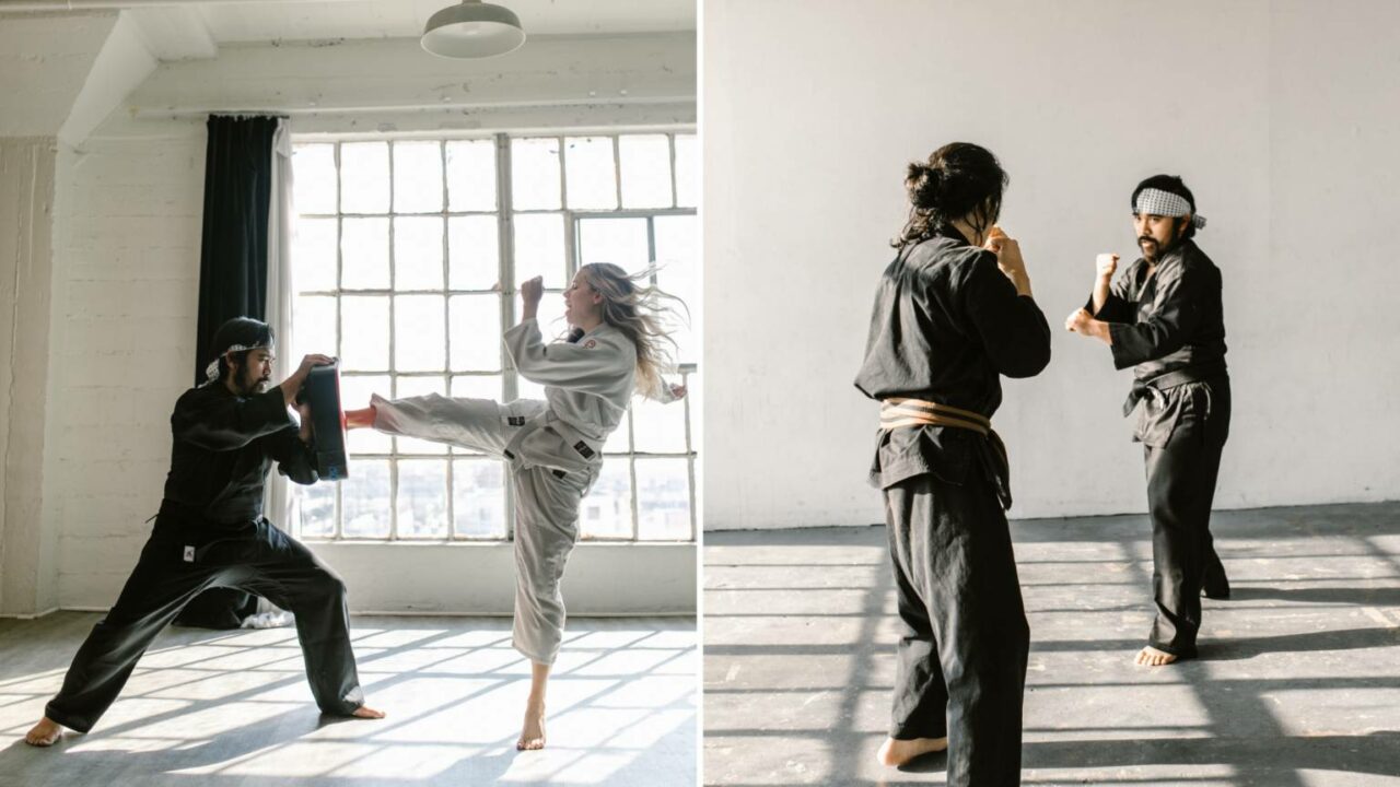 Martial arts students training in a sunlit studio, one kicking a pad held by an instructor and two others sparring