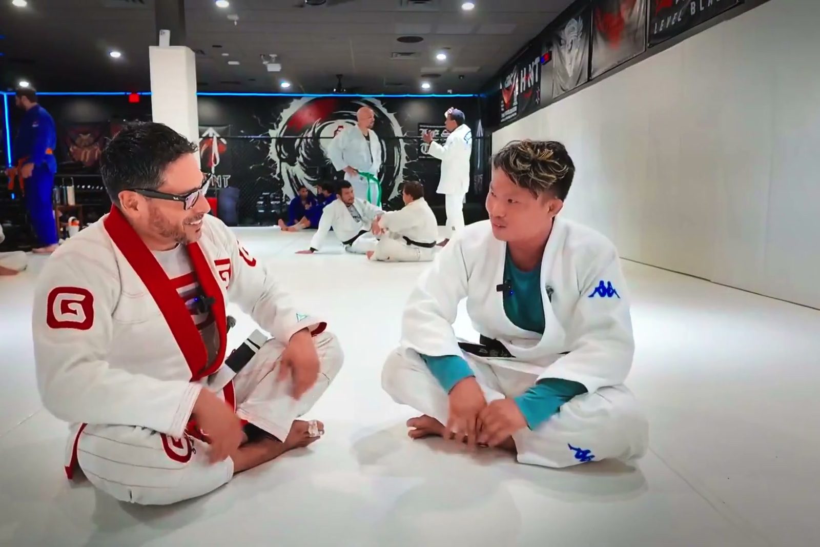Alex Cuevas and Lakea Vargas laughing on the mat at Combat Sports Academy