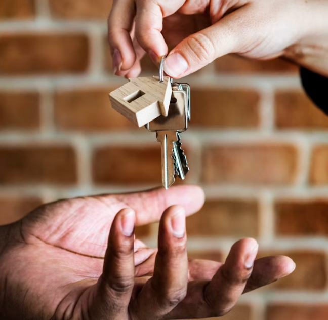 Handing over house keys during a real estate closing