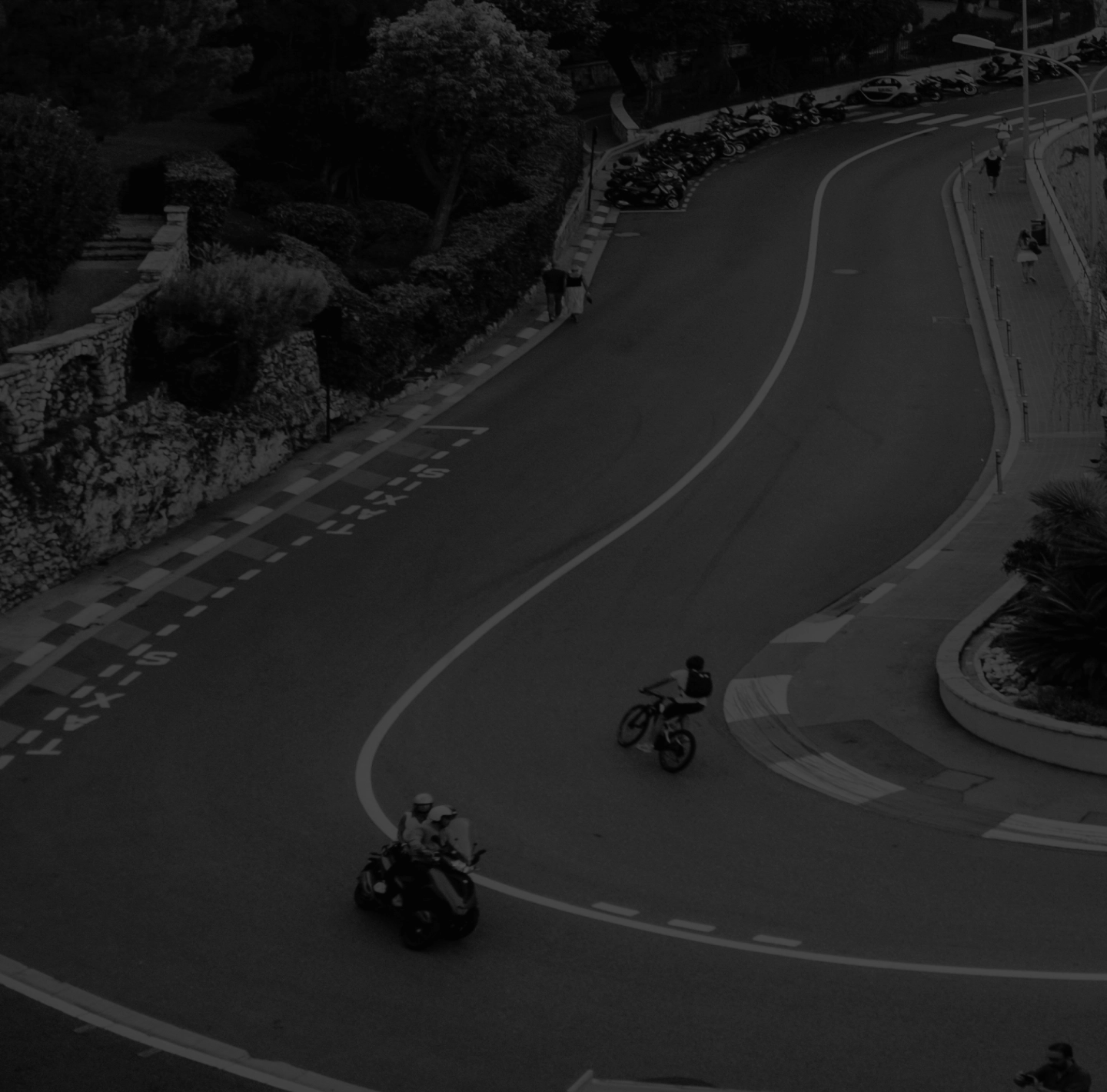 A copter view to the road cyclist on a curve