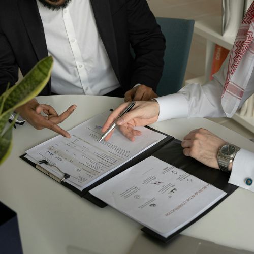 Agent reviewing and explaining real estate documents with a client.