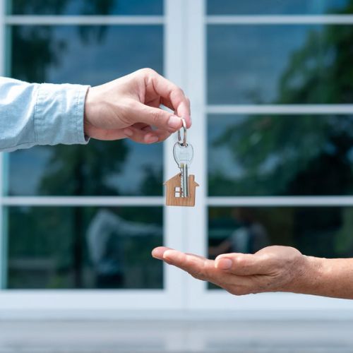 Homebuyer receiving house keys during closing.