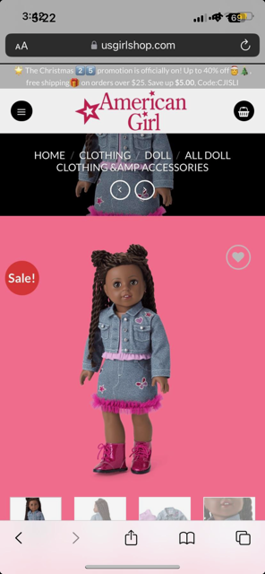 A Black American Girl doll with long braids wears a denim jacket and skirt with pink trim and embroidery, a pink top, and pink boots. The background is solid pink, and a red "Sale!" badge is visible on the left.