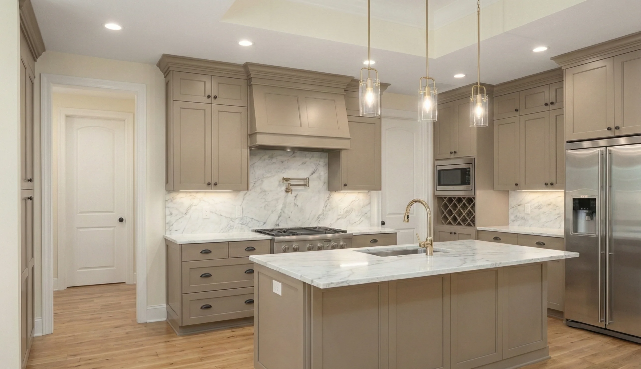 Modern kitchen with beige cabinetry, marble countertops and backsplash, stainless steel appliances, and wooden flooring.