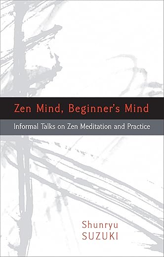 Book cover of 'Zen Mind, Beginner's Mind' by Shunryu Suzuki featuring abstract grey brush strokes on a white background.