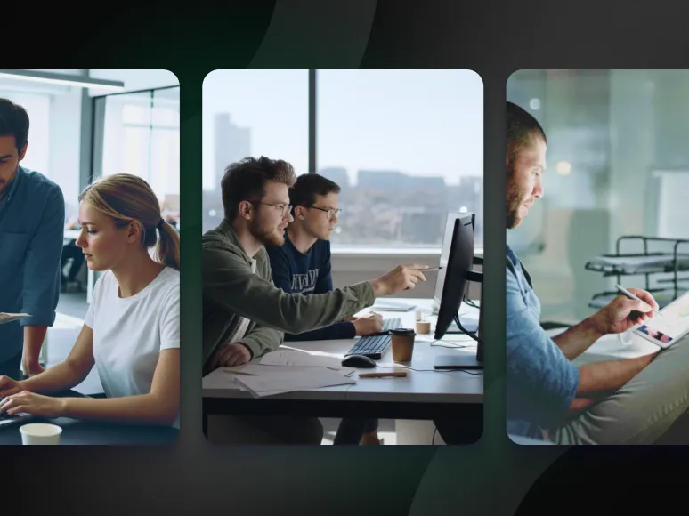Two men working together at a desk pointing at a computer screen in a bright office with city view windows.
