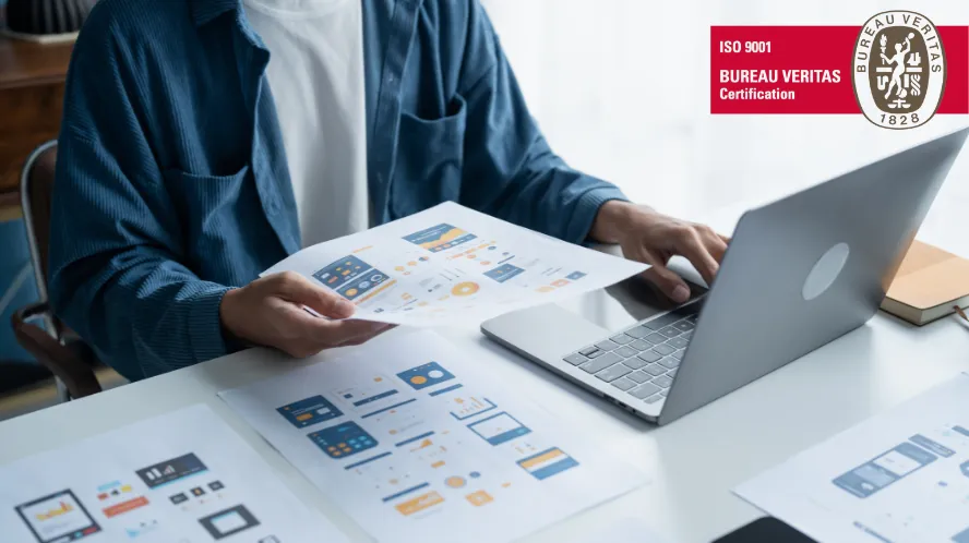 Two people shaking hands in a business setting.