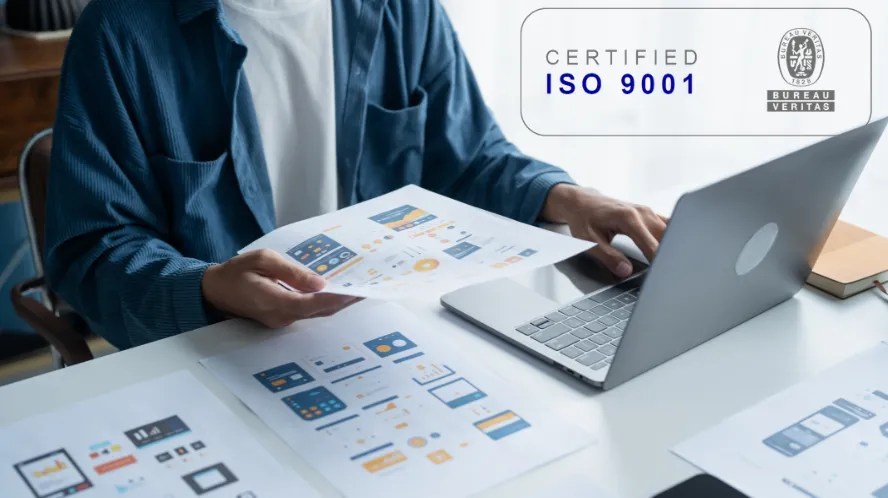 Two people shaking hands in a business setting.