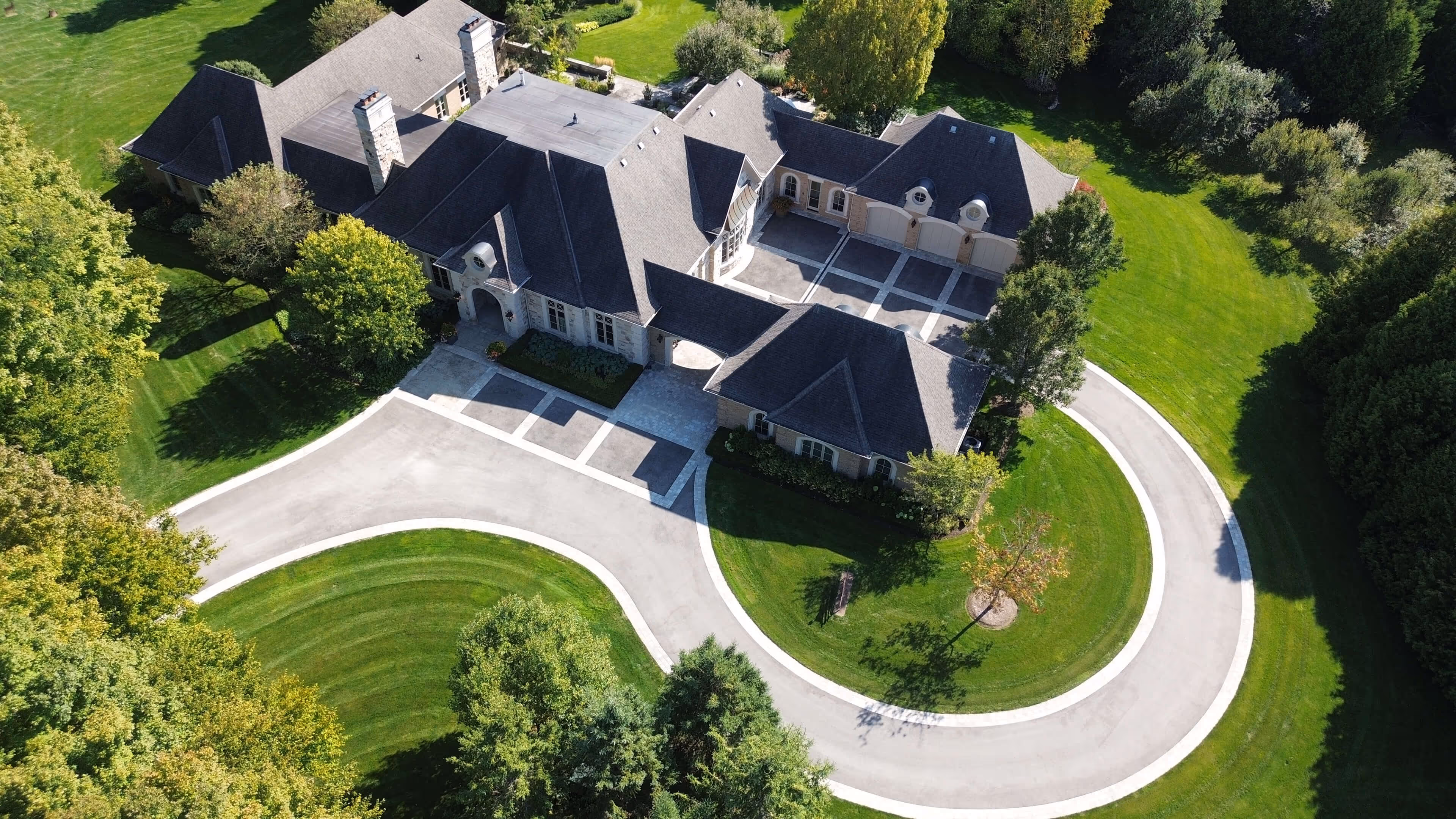 backyard landscaping with pool featureing waterfalls flowing into the pool, cabana with fireplace