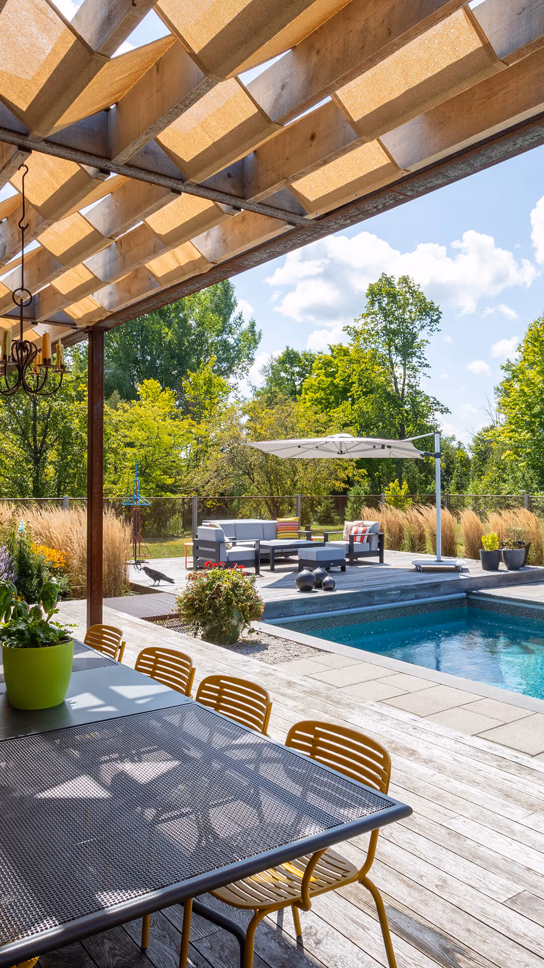backyard landscaping with pool featureing waterfalls flowing into the pool, cabana with fireplace