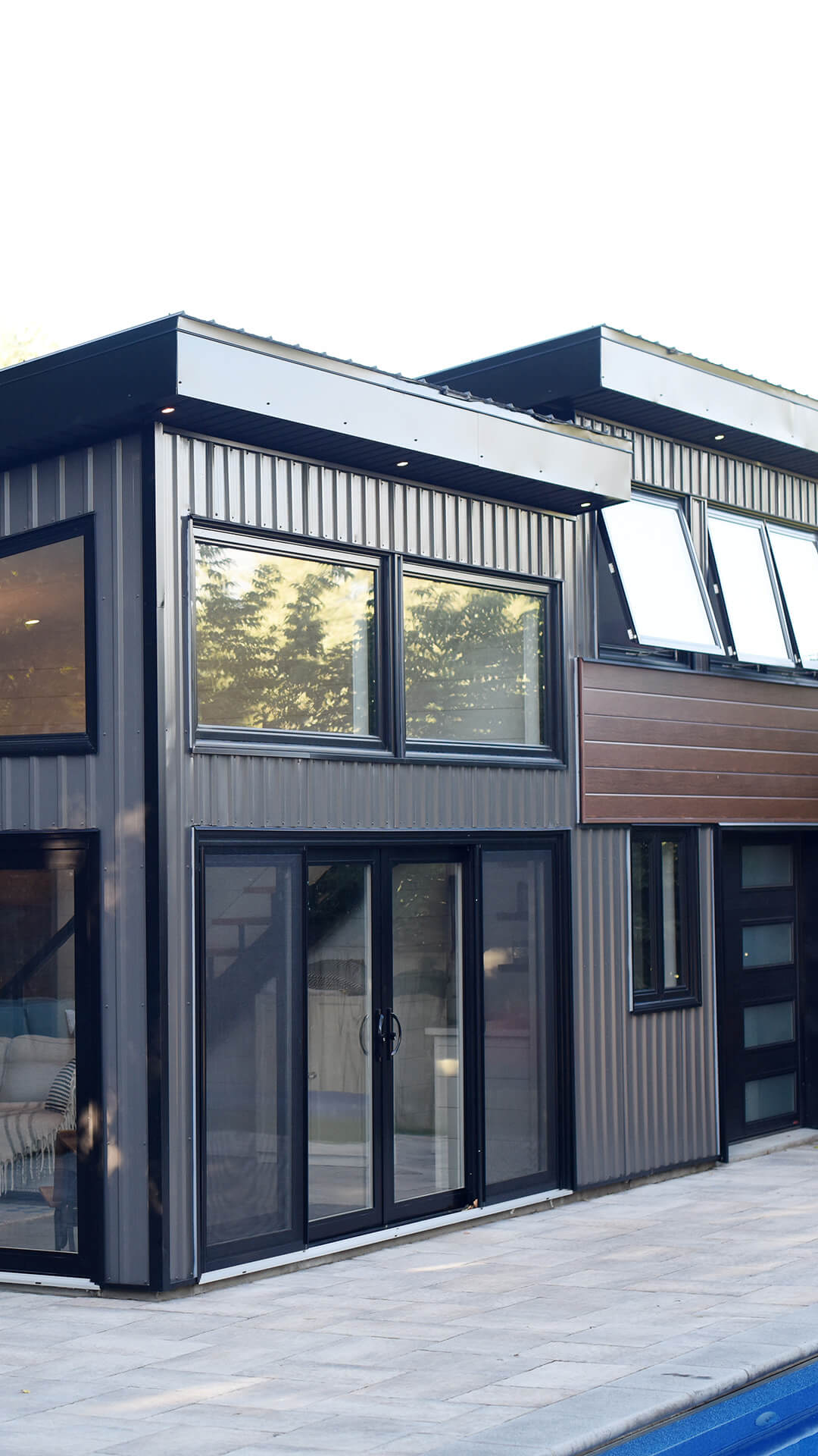 backyard landscaping with pool featureing waterfalls flowing into the pool, cabana with fireplace